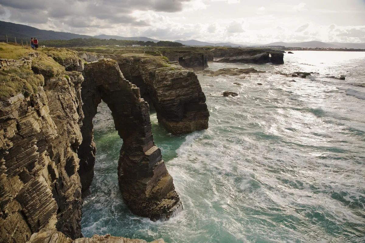 Rock arches and sea caves at As Catedrais beach at low tide, Galicia
