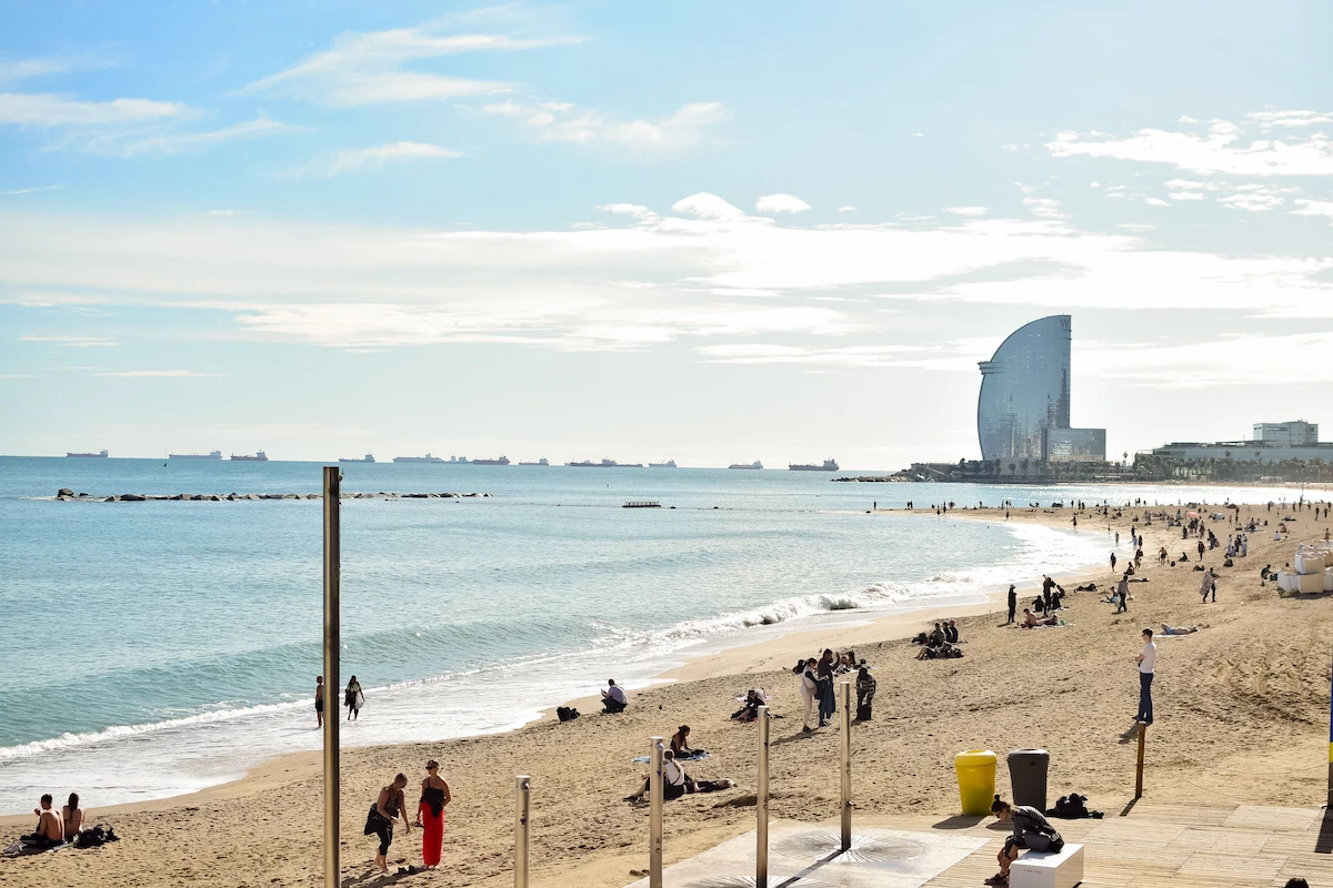 Barceloneta beach with the Barcelona skyline behind it