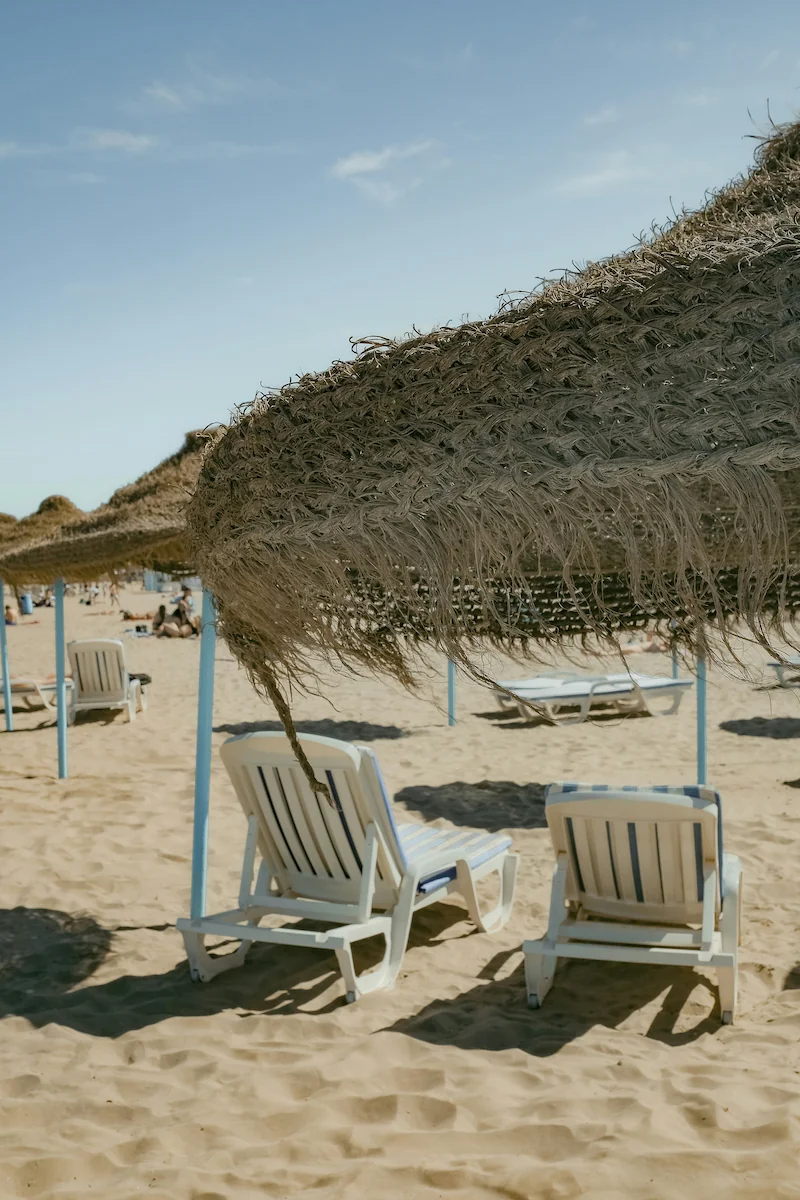 Beach chairs and straw umbrellas on Malvarrosa beach, Valencia