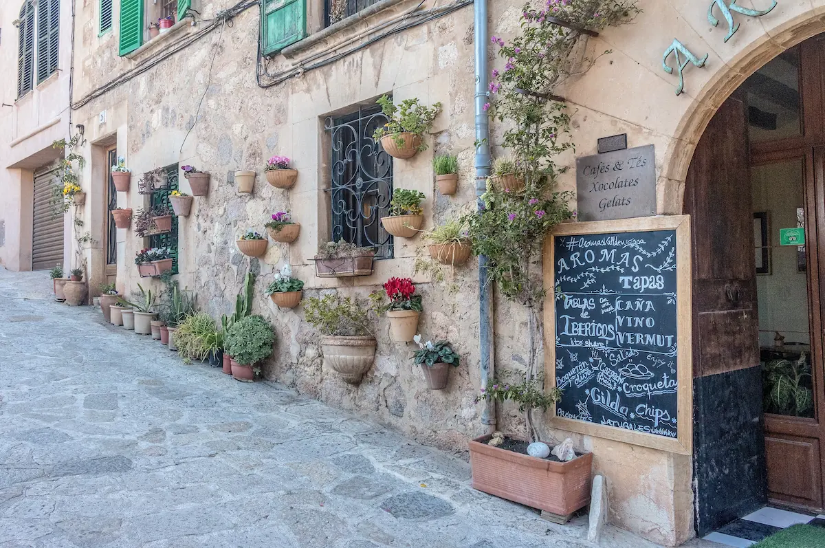 Flower-lined stone walls in the village of Valldemossa, Mallorca